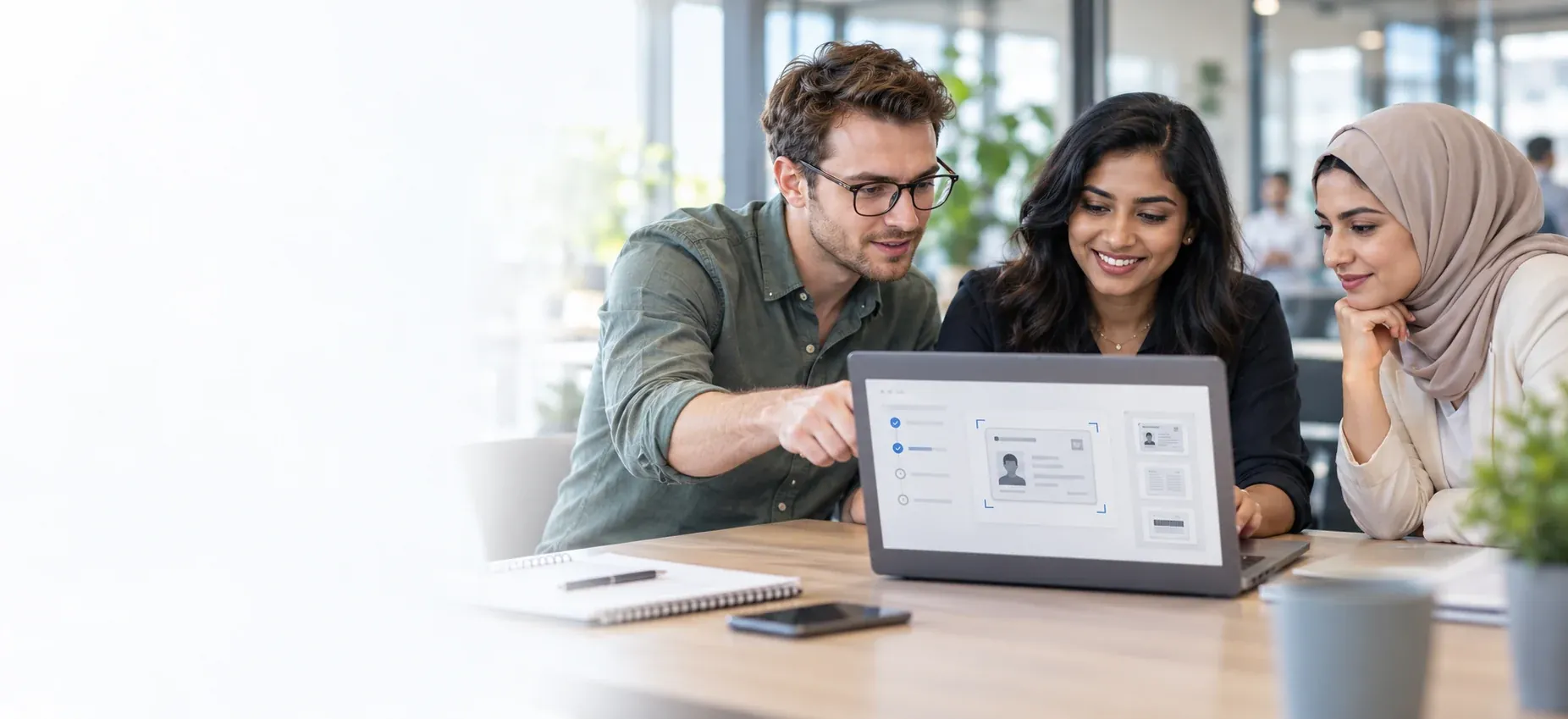 Arab, European and Indian colleagues review an identity workflow together